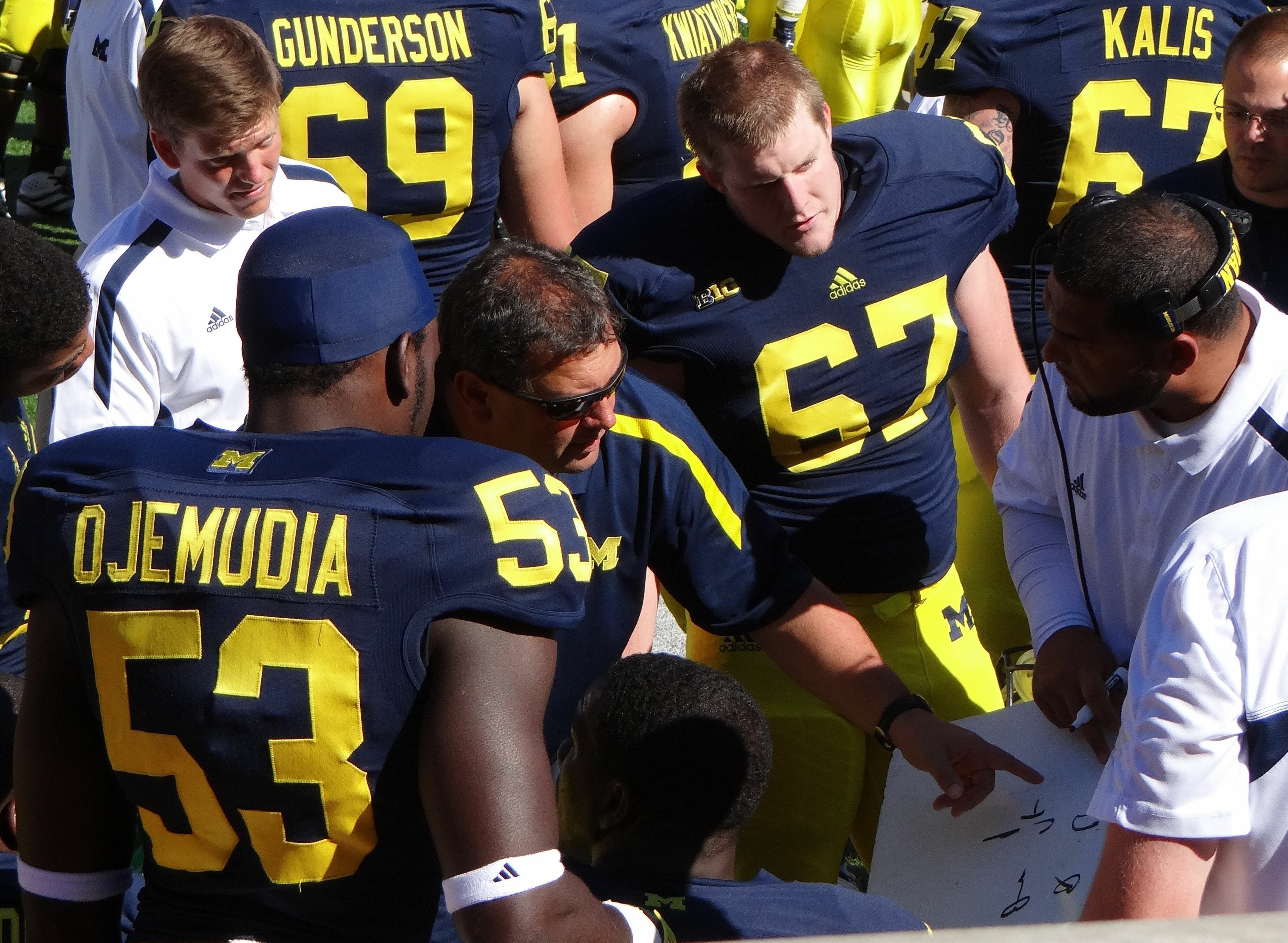 Brady_Hoke_and_Jerry_Montgomery_with_defensive_linemen