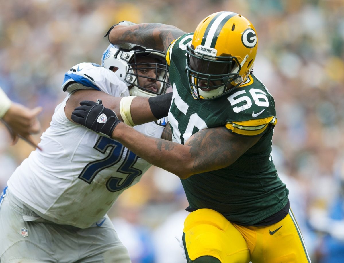 Sep 25, 2016; Green Bay, WI, USA; Green Bay Packers linebacker Julius Peppers (56) rushes around Detroit Lions guard Larry Warford (75) during the fourth quarter at Lambeau Field. Green Bay won 34-27. Mandatory Credit: Jeff Hanisch-USA TODAY Sports