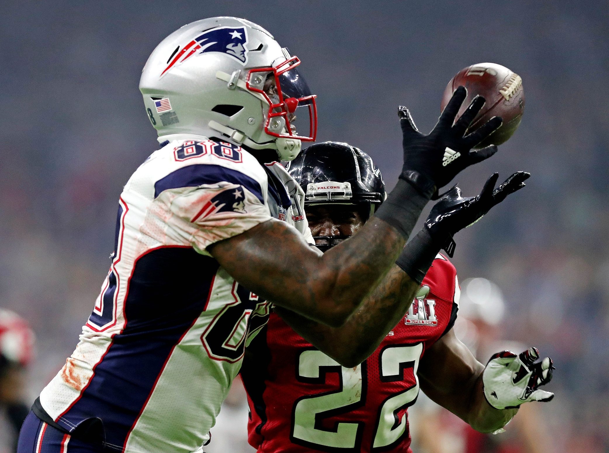 Feb 5, 2017; Houston, TX, USA; New England Patriots tight end Martellus Bennett (88) catches a pass against Atlanta Falcons strong safety Keanu Neal (22) during the fourth quarter during Super Bowl LI at NRG Stadium. Mandatory Credit: Matthew Emmons-USA TODAY Sports