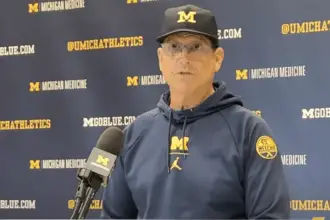 Michigan Football offensive line Santa Ono non-committal about Jim Harbaugh coaching